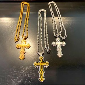 3 stainless steel cross necklaces.